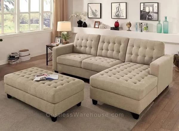 Beige tufted sectional sofa with matching ottoman in a bright living room